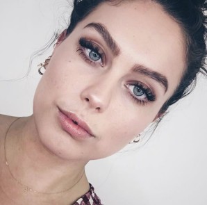 Client with fluttery lash extensions and defined brows