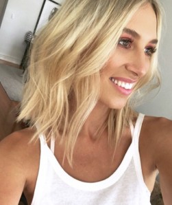 Smiling client with natural-looking lash extensions